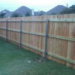 Stockade wood fence installation